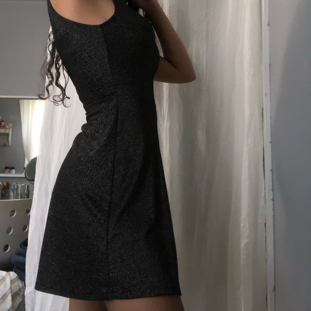Black halter neck mini dress with a v-back